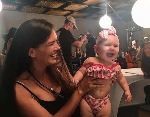 Swimsuit Model Walks The Ramp Breastfeeding Baby